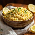 Rice Pilaf In Rustic Bowl With Lemon And Parsley
