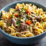 Crockpot Beef and Noodles in rustic bowl