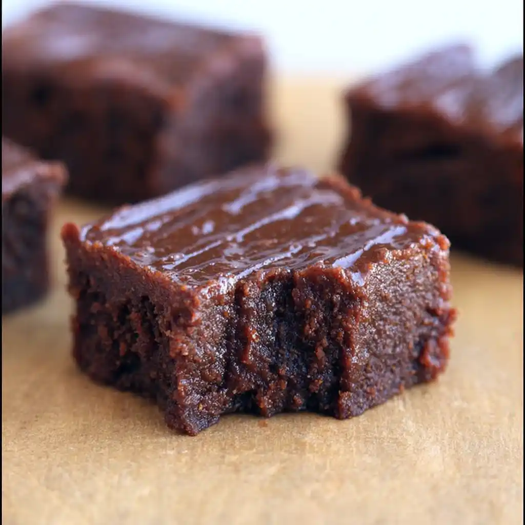 Delicious homemade sweet potato brownies topped with chocolate.