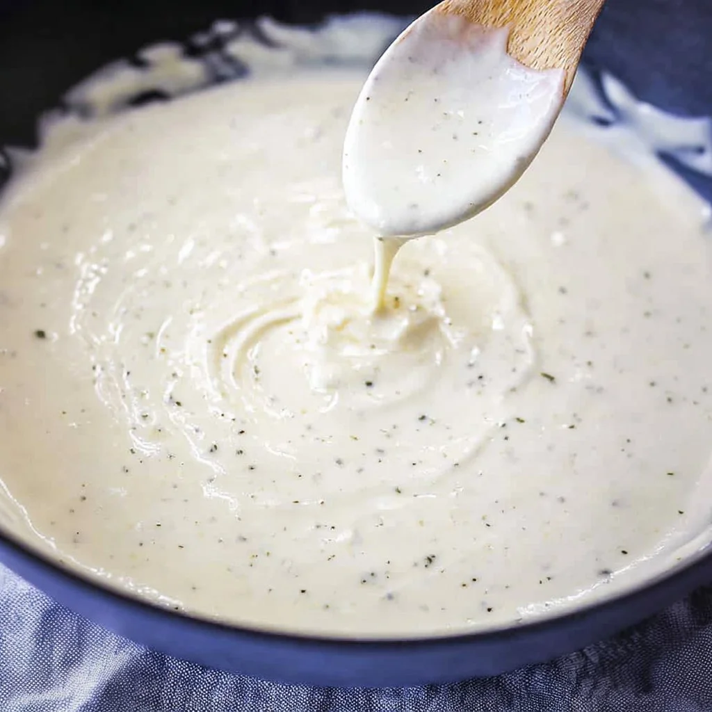 Creamy homemade Alfredo sauce served over fettuccine pasta