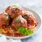 Delicious homemade meatballs served in a savory sauce on a plate