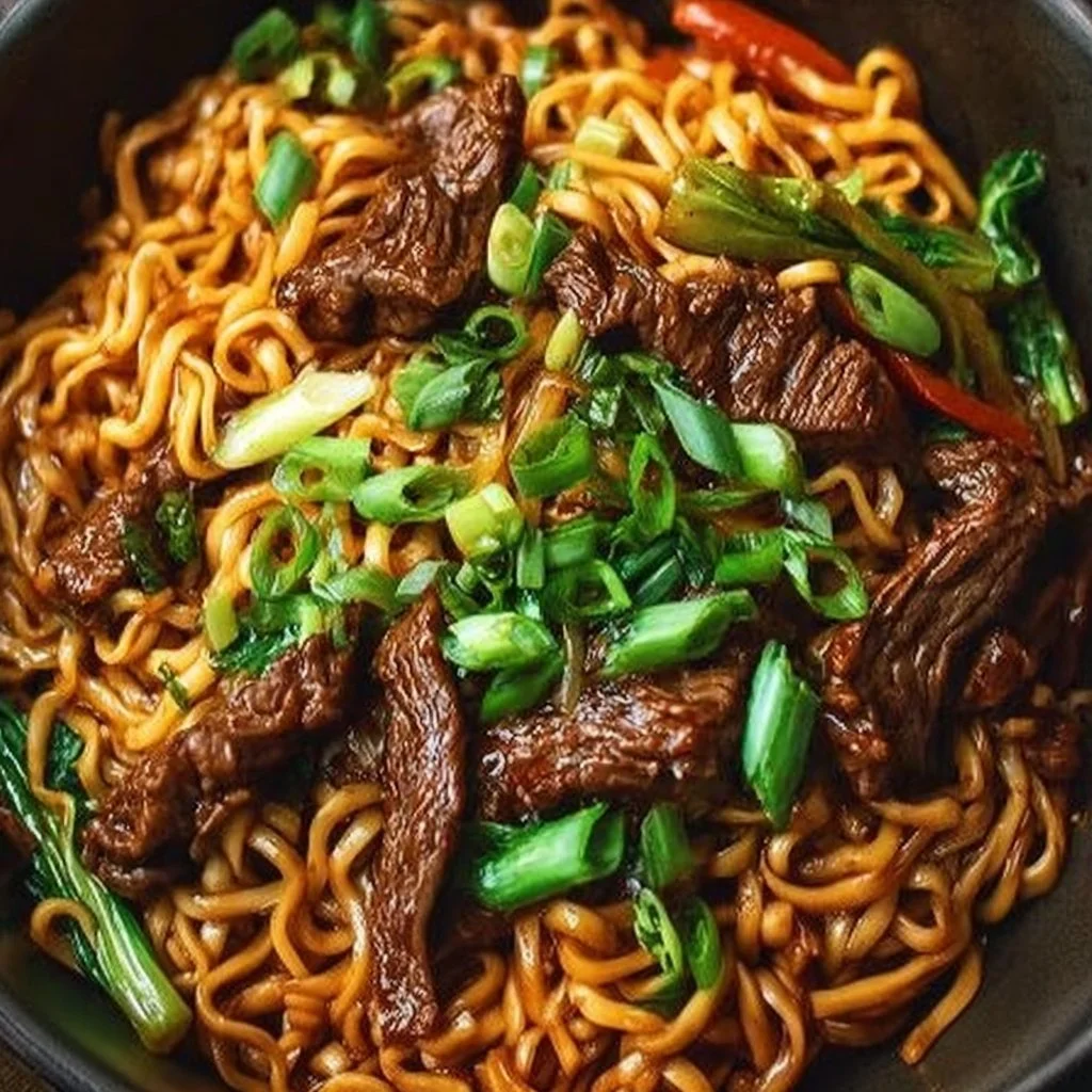 Bowl of flavorful hoisin beef noodles with vegetables, ready in 25 minutes.
