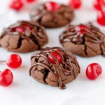 Delicious homemade chocolate covered cherry cookies on a plate.