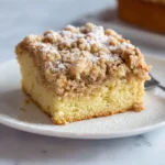 Delicious homemade Crumb Cake with a buttery crumb topping served on a plate