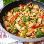 Delicious easy peanut chicken stir fry served with vegetables on a plate.