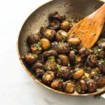 Sautéed garlic butter mushrooms in a skillet, delicious side dish