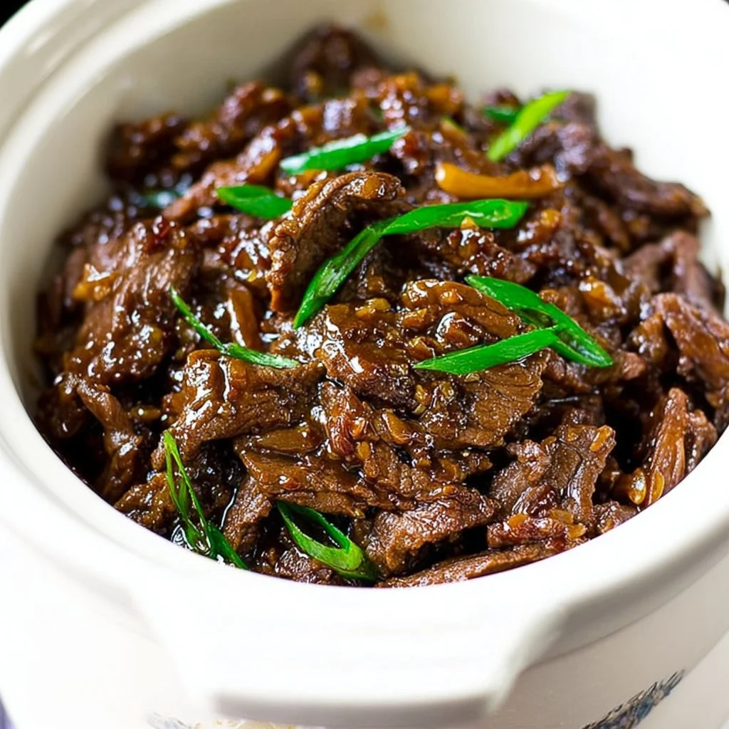 Delicious Slow Cooker Mongolian Beef served with rice and vegetables