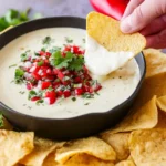 Delicious white queso dip served in a bowl, perfect for dipping.