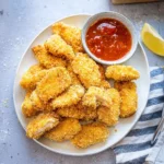 Crispy air fryer chicken nuggets served with dipping sauce