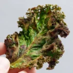 Baked kale chips in a bowl, a healthy snack option