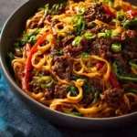 Caramelized Beef Peanut Noodles with Lime and Ginger served in a bowl