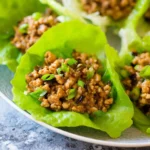 Delicious Chicken Lettuce Wraps filled with veggies and savory chicken in crisp lettuce leaves.