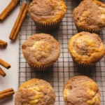 Freshly baked cinnamon muffins topped with a sprinkle of cinnamon sugar
