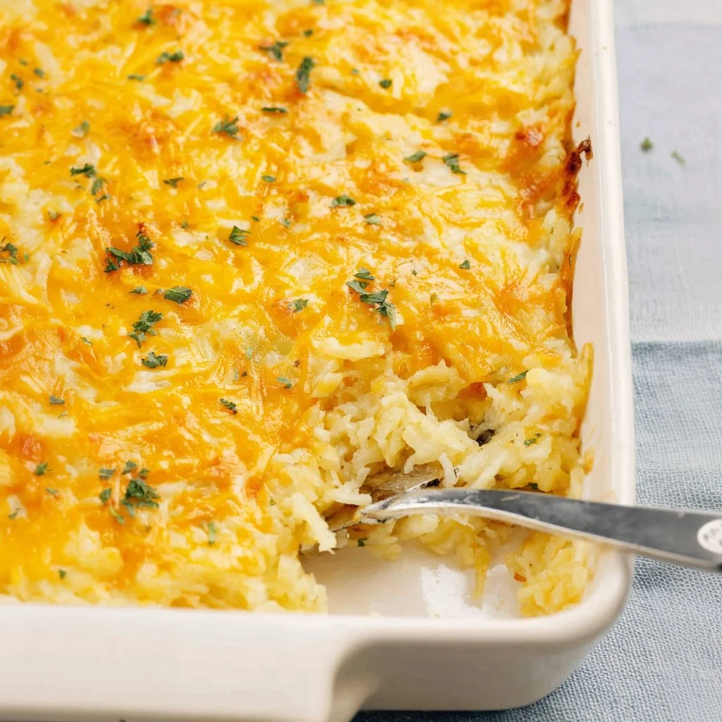 A delicious hashbrown casserole served in a cozy family setting.