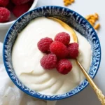 Delicious cottage cheese pudding topped with fresh fruits and nuts.