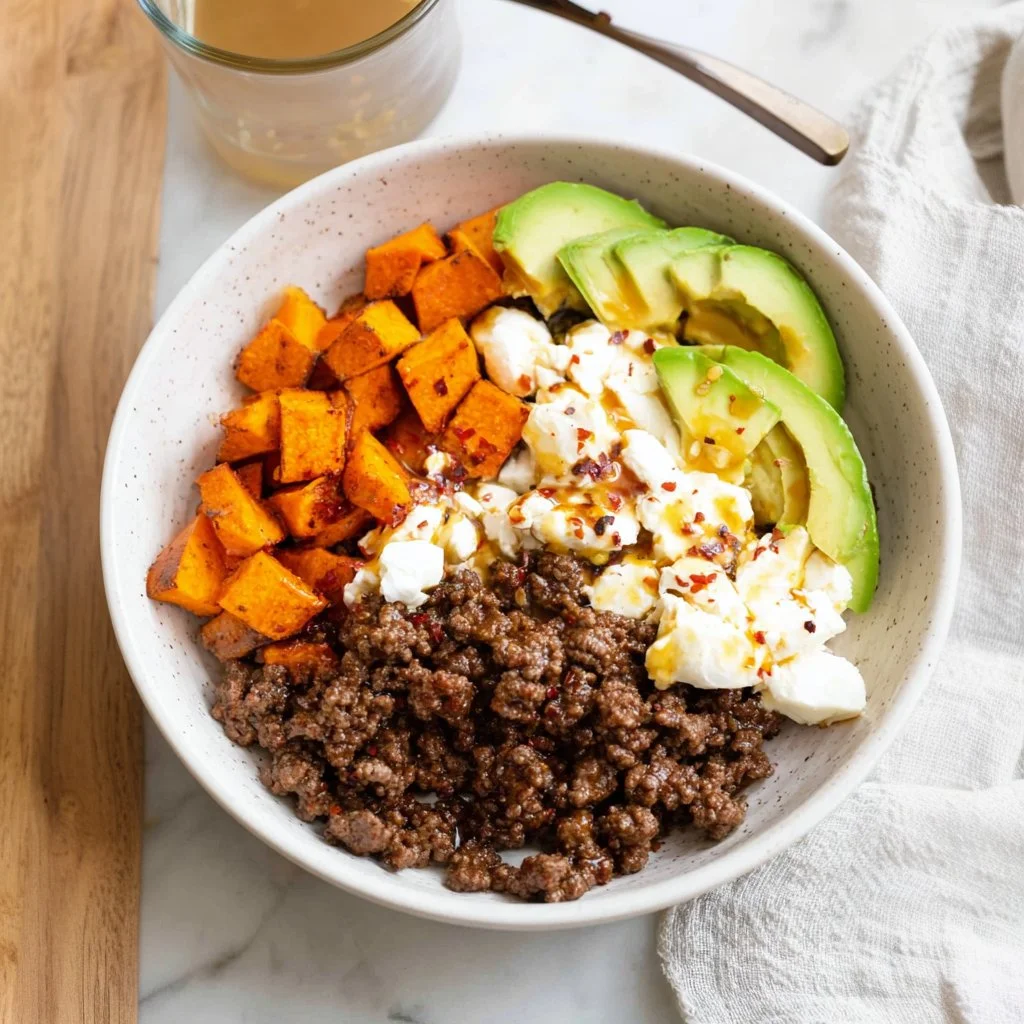 Delicious hot honey ground beef bowls topped with vegetables and spices