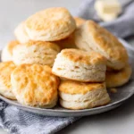 Delicious cream cheese biscuits fresh out of the oven, golden and fluffy.