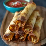 Delicious cream cheese chicken taquitos served with dipping sauce