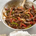 Delicious easy pepper steak served with vegetables on a plate.