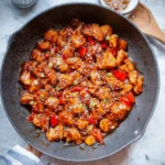 Delicious Firecracker Chicken served in a bowl with rice and vegetables