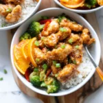Golden Delicious Orange Chicken Meal Prep Bowl with rice and vegetables
