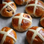 Freshly baked Hot Cross Buns with spices and icing on top, perfect for Easter.
