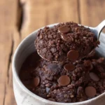 Delicious Keto Mug Cake topped with berries in a microwave-safe mug