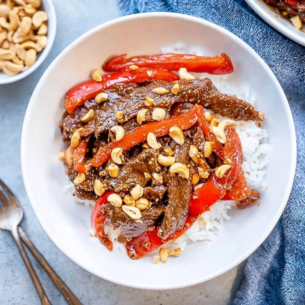 Delicious Kung Pao Beef served in a bowl with vegetables and peanuts