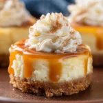 Mini cheesecakes topped with caramel sauce on a dessert plate