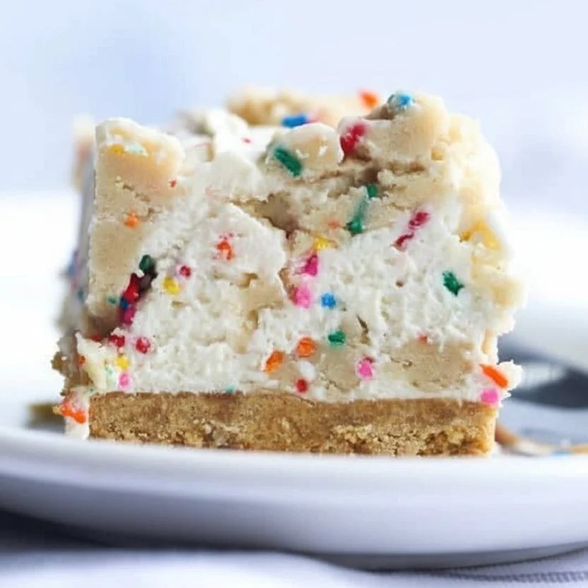 Slice of No Bake Cookie Dough Cheesecake with cookie dough topping