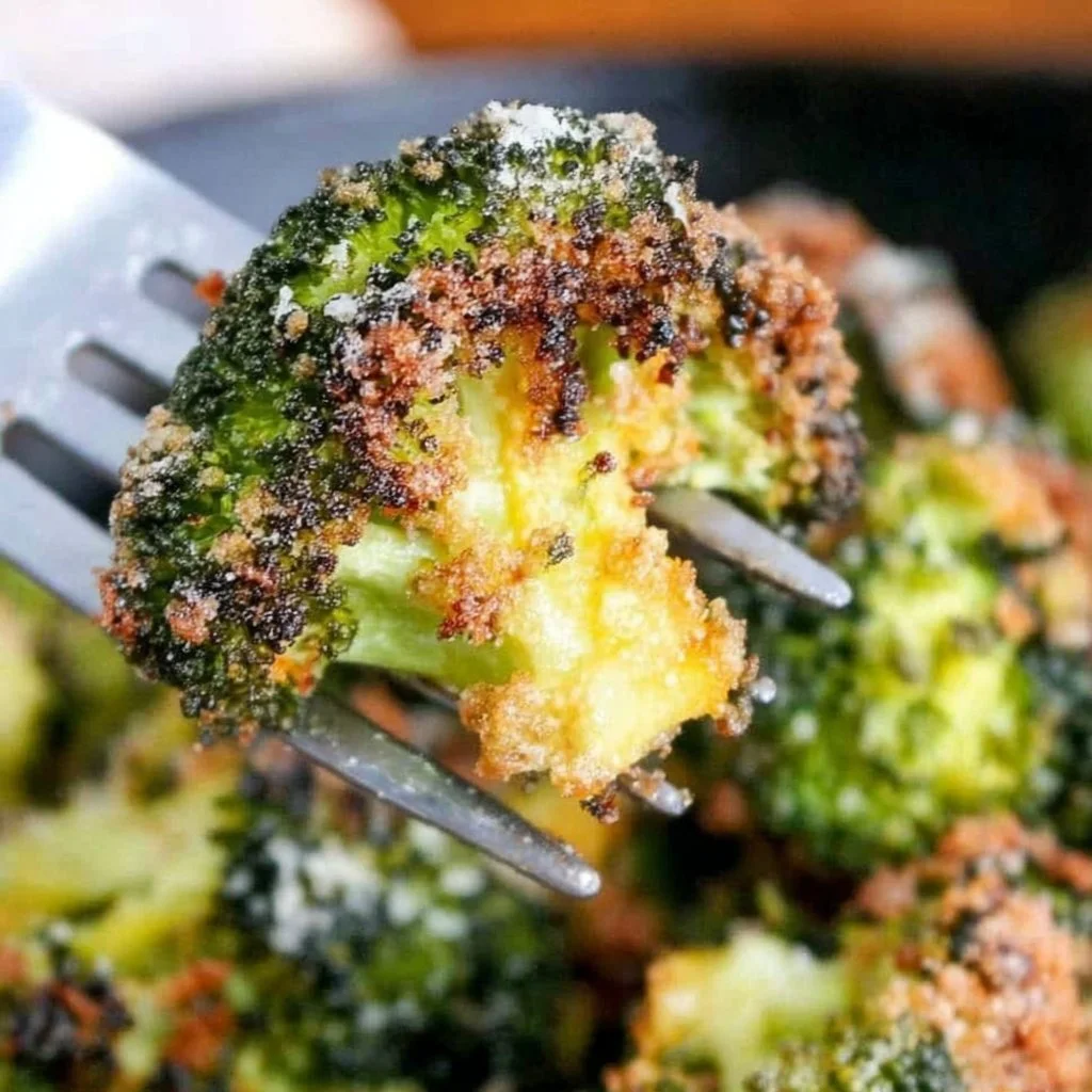 Delicious Parmesan Roasted Broccoli recipe topped with cheese and spices.