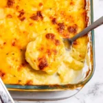 Delicious creamy potatoes au gratin served in a baking dish