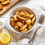 Bowl of delicious roasted parsnips with herbs and spices