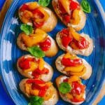 Delicious roasted pepper bruschetta served on toasted bread slices.