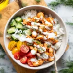 Delicious Sriracha Ranch Chicken Bowls topped with fresh ingredients and sauce.