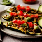 Taco Zucchini Boats filled with seasoned ground beef and topped with cheese