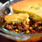 Delicious homemade tamale pie served with toppings