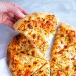 Homemade pizza dough ready for topping and baking