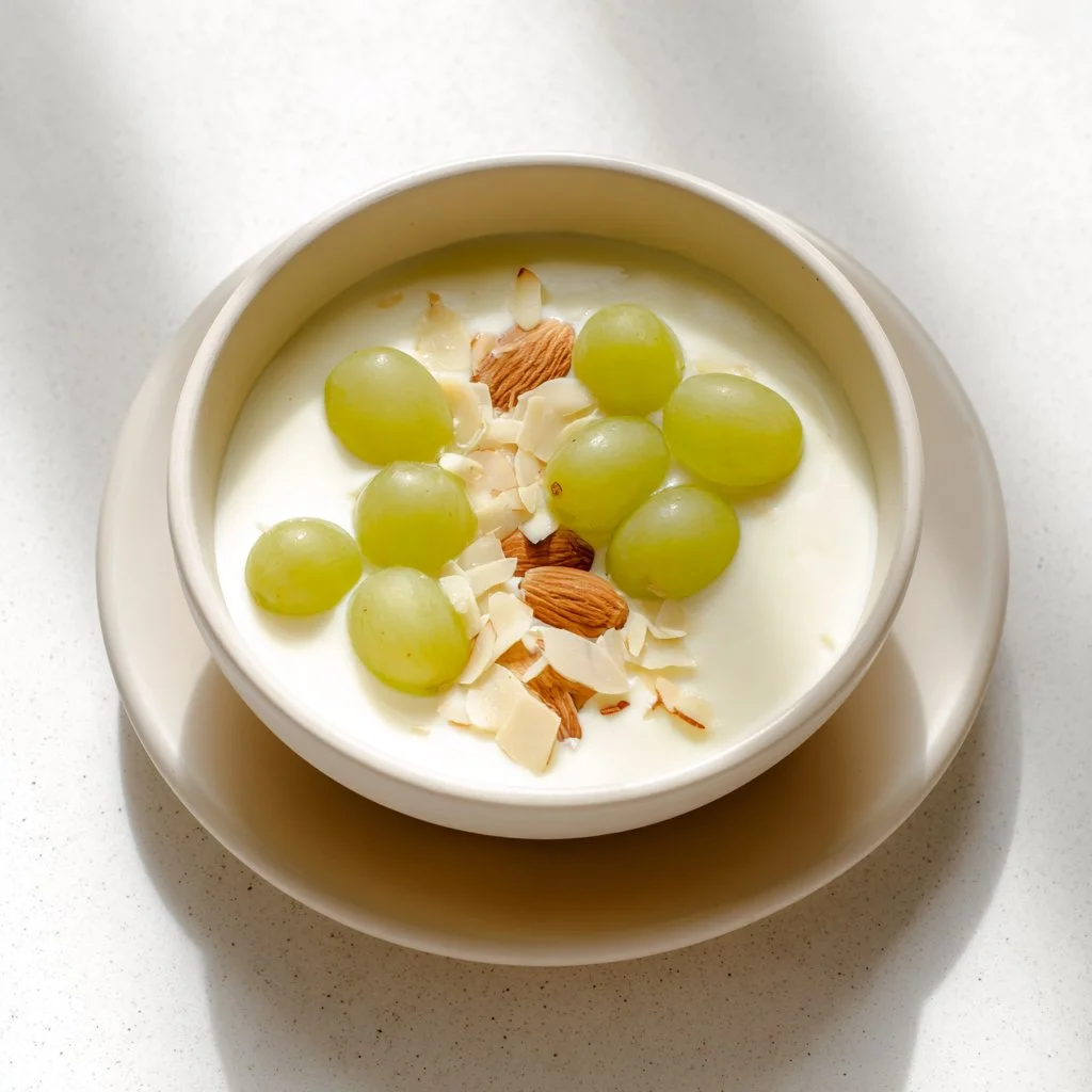 Delicious Spanish Chilled Almond Soup garnished with herbs and served in a bowl