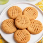 Baked 2 ingredient peanut butter cookies on a cooling rack.
