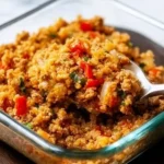 A bowl of spicy cauliflower rice with ground turkey and vegetables, ready to serve.