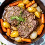 Succulent Beef Pot Roast with herbs and vegetables in a rich savory sauce