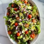 Fresh and colorful simple side salad served in a bowl