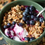 Delicious blueberry granola bowls topped with fresh blueberries and nuts