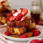 Delicious Brioche French Toast topped with syrup and berries