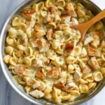 Creamy chicken macaroni and cheese topped with golden breadcrumbs