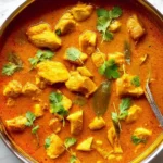 Delicious Coconut Chicken Curry served in a bowl with fresh ingredients