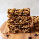 Baked oatmeal breakfast bars served on a cozy table, perfect for mornings.