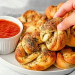 Freshly made easy homemade garlic knots on a plate