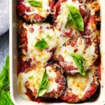 Delicious Eggplant Parmesan with layers of eggplant, marinara sauce, and cheese